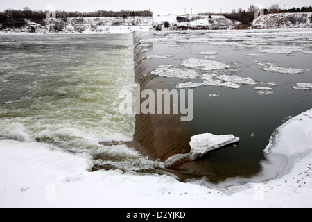 weir on the south Saskatchewan river in winter Saskatoon Canada Stock Photo