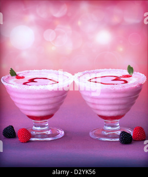 Picture of tasty ice cream in glass cup with red heart decoration, fresh raspberry fruits, romantic pink dessert Stock Photo