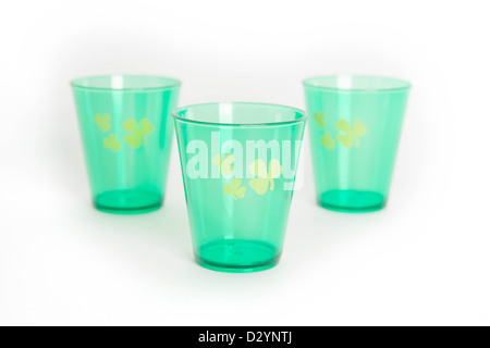 Green St. Patrick's Day shot glasses with shamrock isolated on white background Stock Photo