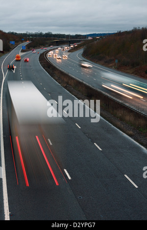 A low light shot of traffic traveling along the M20 motorway in Kent, England Stock Photo