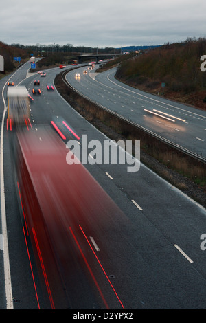 A low light shot of traffic traveling along the M20 motorway in Kent, England Stock Photo