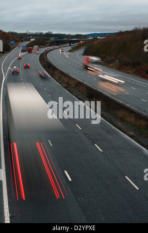 A low light shot of traffic traveling along the M20 motorway in Kent, England Stock Photo