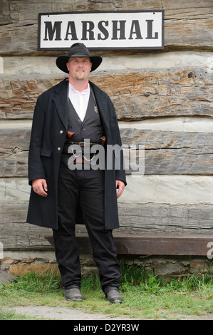 Marshal in the old American west standing watch, authentic reenactor portrayal of sheriff Wyatt Earp. Stock Photo