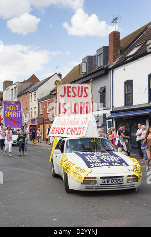 Evangelical Christian group proclaiming a message of repentance and conversion in the 2012 Gloucester carnival procession. Stock Photo