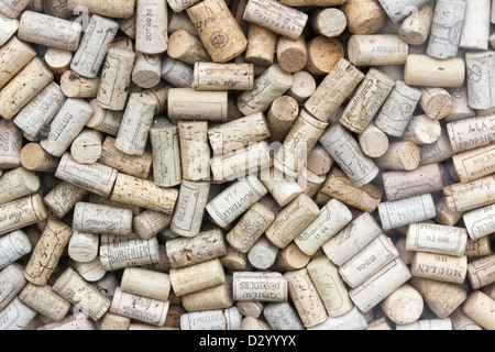 Full frame of wine bottle corks, many printed in French, which form part of a window display of a wine shop in Bath. Stock Photo