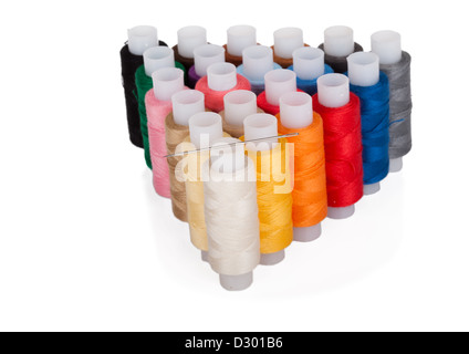 Needle and color threads on isolated on white background Stock Photo