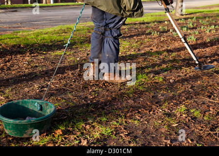 Detectorist. Person searching land using a metal detector, Derby, England, UK Stock Photo