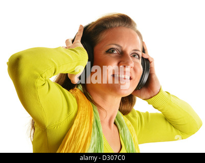 Happy young woman listening to the music in headphones isolated on white background Stock Photo