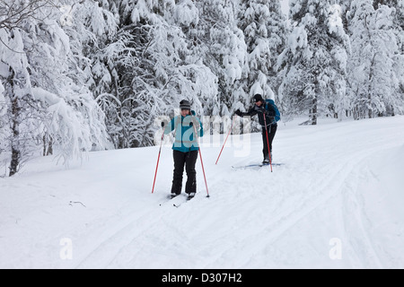 Cross Country Skiers in the Pallas-Yllästunturi National Park Near Yllas in Finnish Lapland Finland Stock Photo