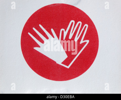 Symbol photo, wear gloves Gebotsschild Stock Photo - Alamy