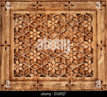 Floral ornament on orange limestone stone wall in Jaisalmer, Rajasthan style Stock Photo