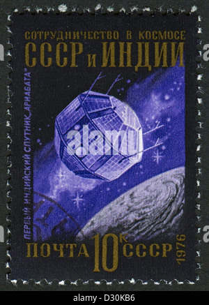 USSR - CIRCA 1976: A stamp printed in USSR shows image of the Aryabhata satellite, circa 1976.  Stock Photo