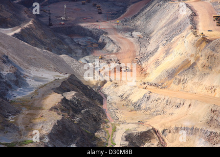 Huge trucks in the biggest Canadian open pit iron mine in Fort Wright Next to Fermont Caniapiscau Northeastern Quebec Canada Stock Photo