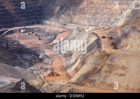 Huge trucks in the biggest Canadian open pit iron mine in Fort Wright Next to Fermont Caniapiscau Northeastern Quebec Canada Stock Photo