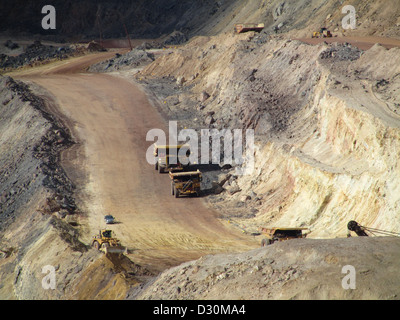 Huge trucks in the biggest Canadian open pit iron mine in Fort Wright Next to Fermont Caniapiscau Northeastern Quebec Canada Stock Photo