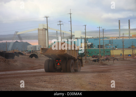 Huge trucks in the biggest Canadian open pit iron mine in Fort Wright Next to Fermont Caniapiscau Northeastern Quebec Canada Stock Photo