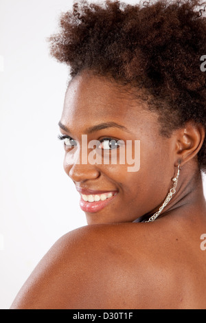 Lovely black woman looking over her shoulder at the camera and smiling ...