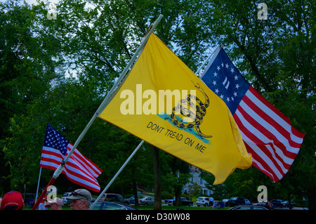 Three flags rippling in the wind at public green in Lexington Ma Stock Photo