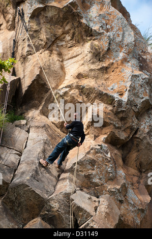 Abseiling down Fisher's tower, Hell's Gate National Park, Naivasha, Kenya Stock Photo