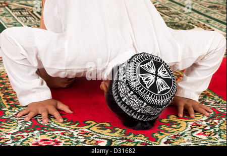 Muslim Child Praying Stock Photo