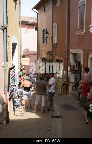 tourists walking and shopping in Roussillon old town, Procence, France Stock Photo