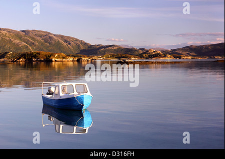 Fishing boat in late afternoon sun, in the northern Norwegian fjords Stock Photo