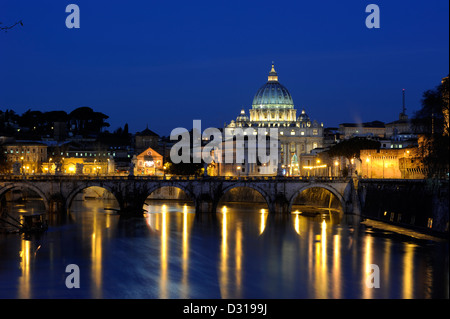Italy, Rome skyline, Tiber river, Sant'Angelo bridge and St Peter's basilica at night Stock Photo