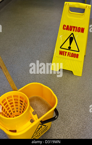 Mop, Bucket and Caution Wet Floor Stock Photo - Image of spanish