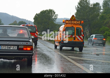Accident vehicle in the rain on a highway, France Stock Photo