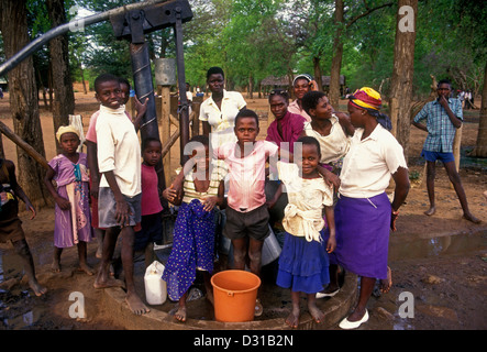 Zimbabwean people, women and children, pumping water from well, water well, well water, village of Mahenye, Manicaland Province, Zimbabwe, Africa Stock Photo