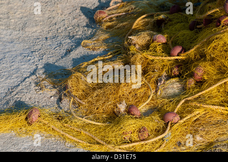 Fishing nets left in the sun to dry. Stock Photo