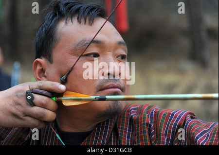 Bhutanese man practicing archery, the country's national sport. Stock Photo