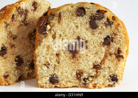 chocolate chip muffin cut in half set on white background Stock Photo