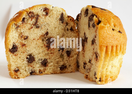 chocolate chip muffin cut in half isolated on white background Stock Photo