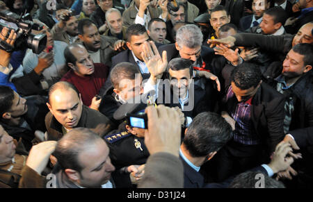 Feb. 5, 2013 - Gaza City, Gaza Strip, Palestinian Territory - Iranian President Mahmoud Ahmadinejad greets supporters upon his arrival for a visit to al-Hussein mosque in Cairo on February 5, 2013. Ahmadinejad held talks in Cairo on the divisive issue of Syria's war, as he kicked off the first visit to Egypt by an Iranian president since 1979  (Credit Image: © Ahmed Asad/APA Images/ZUMAPRESS.com) Stock Photo