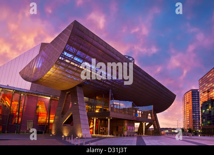 The Lowry Centre at Salford Quays illuminated at sunset Manchester Greater Manchester Lancashire England GB UK EU Europe Stock Photo