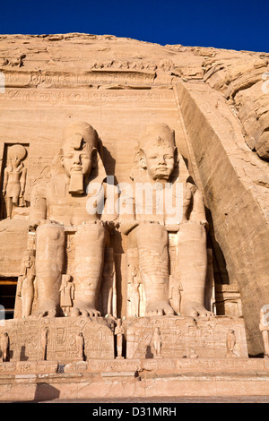 Statues of pharaoh Ramesses II wearing the double Atef crown of Upper and Lower Egypt at Abu Simbel Stock Photo