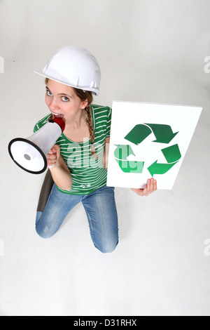 Construction worker promoting recycling Stock Photo