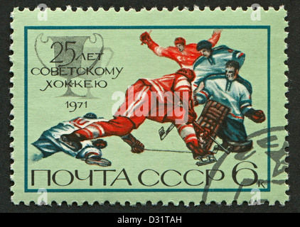 USSR - CIRCA 1971: Postage stamps printed in USSR dedicated to 25th Anniversary of the Soviet Hockey, circa 1971.  Stock Photo