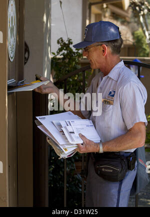 Feb. 6, 2013 - Modesto, CA, USA - Mail man Robin Smith delivers mail to ...