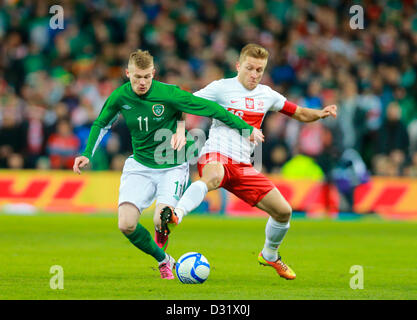 06.02.2013. Dublin, Ireland.  James McClean (Ireland) is challenged by Jakub Blaszczykowski (Captain Poland) during Rep of Ireland versus  Poland international football friendly at Aviva Stadium, Dublin, Ireland. Stock Photo