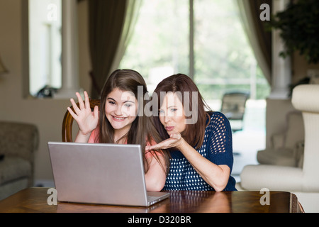 Caucasian mother and daughter having video chat on laptop Stock Photo