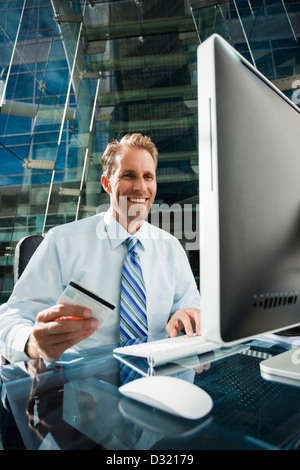 Caucasian businessman shopping online Stock Photo