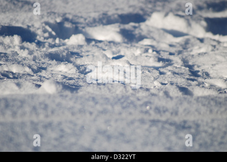 Up close detail of thick snow partly unspoiled untouched showing crystals of frost and different depth of fields for creativity Stock Photo