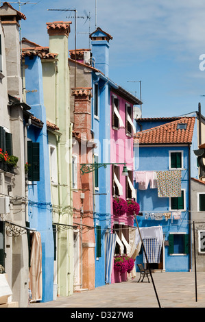 Houses and laundry on Campo Pescheria, Burano, Venice, Italy. Stock Photo