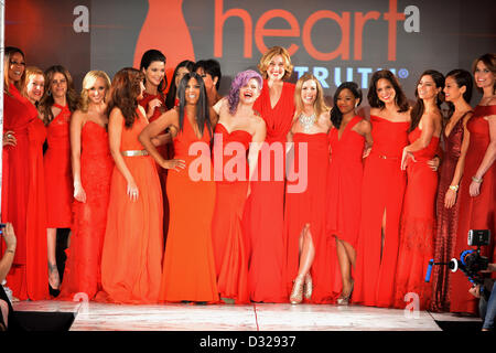 NEW YORK, NY - FEBRUARY 06: (L-R) Wendy Williams, Cindy Parsons, Jillian Michaels, Kendall Jenner, Kylie Jenner, Kris Jenner, Toni Braxton, Kelly Osbourne, Brenda Strong,Torah Bright , Gabrielle Douglas, Soledad O'Brien, Roselyn Sanchez, Jamie Chung, and Savannah Guthrie dance on the runway at The Heart Truth's Red Dress Collection during Fall 2013 Mercedes-Benz Fashion Week at Hammerstein Ballroom on February 6, 2013 in New York City. Stock Photo