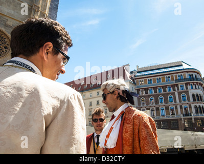 Tickets sellers in historical cloths and wig in front of Stephansdom Stock Photo