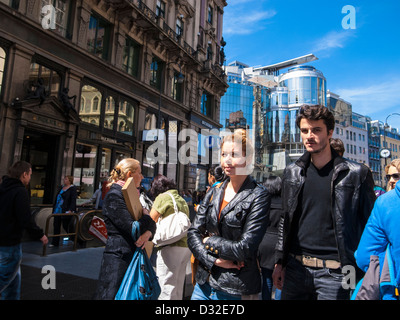 young man an woman walking street in sunny day Stock Photo