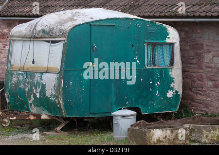 old caravan, abandoned, derelict, decrepit, peeling paintwork. disused, Stock Photo