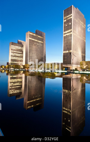 Agency buildings by reflecting pool, part of the Governor Nelson A. Rockefeller Empire State Plaza in Albany New York. Stock Photo